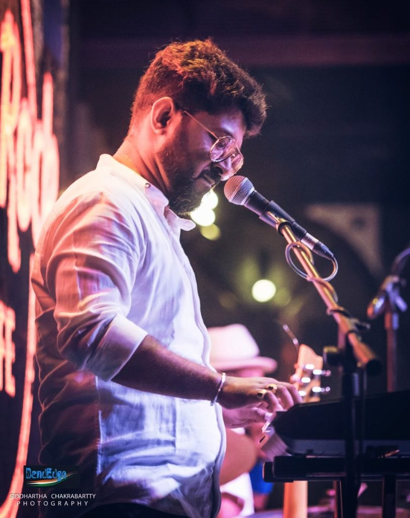 Keyboard teacher Abhishek playing keyboard at music concert